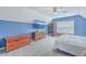 Charming bedroom with blue walls, a queen-size bed, and built-in shelves at 602 Leaning Pin Ct, Summerville, SC 29485