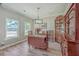 Charming dining room featuring hardwood floors and antique furniture at 602 Leaning Pin Ct, Summerville, SC 29485