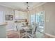 Kitchen with white cabinets, granite countertops, and a breakfast nook at 602 Leaning Pin Ct, Summerville, SC 29485
