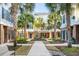 Community courtyard with palm trees, brick buildings, and a central fountain at 656 Coleman Blvd # 606, Mount Pleasant, SC 29464