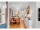 Charming dining room with hardwood floors, a round table, and orange chairs at 656 Coleman Blvd # 606, Mount Pleasant, SC 29464