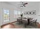 Dining area with hardwood floors, a wooden table and six chairs at 764 Redbud Ln, Summerville, SC 29486