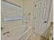 Relaxing bathroom with soaking tub and tile flooring at 8731 Evangeline Dr, North Charleston, SC 29420