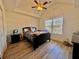 Cozy bedroom with wood floors and a window with blinds at 8731 Evangeline Dr, North Charleston, SC 29420