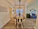 Farmhouse-style dining room with wooden table and chairs at 8731 Evangeline Dr, North Charleston, SC 29420