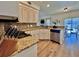Kitchen with granite countertops, white cabinets, and stainless steel appliances at 8731 Evangeline Dr, North Charleston, SC 29420