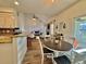 Open kitchen with island, looking toward breakfast nook and Gathering room at 8731 Evangeline Dr, North Charleston, SC 29420