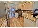 Kitchen boasts granite countertops, stainless steel appliances, and white cabinets at 8731 Evangeline Dr, North Charleston, SC 29420