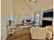 Bright living room features a fireplace, vaulted ceiling, and hardwood floors at 8731 Evangeline Dr, North Charleston, SC 29420