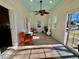 Sunroom with tile floor, ceiling fan, and access to backyard at 8731 Evangeline Dr, North Charleston, SC 29420