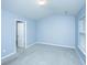 Bedroom with gray carpet, vaulted ceiling and ensuite bathroom at 8875 Jenny Lind St, North Charleston, SC 29406