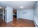 Hardwood floor dining area with kitchen access and light blue walls at 8875 Jenny Lind St, North Charleston, SC 29406