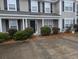 Tan house with white columns, black door, and landscaping at 8875 Jenny Lind St, North Charleston, SC 29406