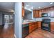 Modern kitchen with black appliances and wood cabinets at 8875 Jenny Lind St, North Charleston, SC 29406