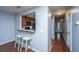 Kitchen features a breakfast bar and dark wood cabinets at 8875 Jenny Lind St, North Charleston, SC 29406