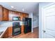 Modern kitchen with black appliances and wood cabinets at 8875 Jenny Lind St, North Charleston, SC 29406