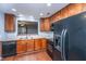 Modern kitchen with black appliances and wood cabinets at 8875 Jenny Lind St, North Charleston, SC 29406