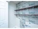 Laundry room with wood-like shelves at 8875 Jenny Lind St, North Charleston, SC 29406