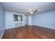 Light-filled living room with hardwood floors and a breakfast bar at 8875 Jenny Lind St, North Charleston, SC 29406