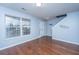 Light blue living room with hardwood floors and a view of the front door at 8875 Jenny Lind St, North Charleston, SC 29406