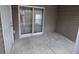 Small concrete patio with sliding glass door access at 8875 Jenny Lind St, North Charleston, SC 29406