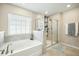 Bathroom boasts a large soaking tub and a separate shower at 9930 Winged Elm St, Ladson, SC 29456