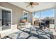 Relaxing screened porch with TV and outdoor seating at 9930 Winged Elm St, Ladson, SC 29456