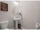 Charming powder room with pedestal sink and oval mirror at 103 Oyama Rd, Summerville, SC 29486