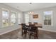 Dining room with hardwood floors and a wood table with four chairs at 103 Oyama Rd, Summerville, SC 29486