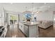 Island kitchen open to Gathering room with fireplace and hardwood floors at 103 Oyama Rd, Summerville, SC 29486