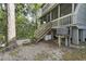 Charming A-frame home with spacious wooden deck and stairs at 1031 Marsh Court Ln, Mount Pleasant, SC 29464