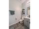 Modern bathroom with gray vanity and floating shelves at 104 Brookhaven Way, Ladson, SC 29456