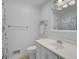 Simple bathroom with white vanity, shower, and floral shower curtain at 107 Old Tavern Ln, Summerville, SC 29485