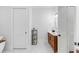 Clean bathroom with a wooden vanity and marble floors at 1086 Cinder St, Mount Pleasant, SC 29464