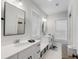 Clean bathroom with double vanity, black accents, and a hexagon tile floor at 1086 Cinder St, Mount Pleasant, SC 29464