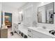 Modern bathroom boasts double vanity, black accents, and a hexagon tile floor at 1086 Cinder St, Mount Pleasant, SC 29464