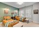 Charming ' bedroom with twin beds, tropical bedding, and green accent wall at 1086 Cinder St, Mount Pleasant, SC 29464