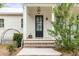 Front porch with brick steps and a black front door at 1086 Cinder St, Mount Pleasant, SC 29464