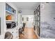 Bright home office features built-in shelving, a desk, and hardwood floors at 1086 Cinder St, Mount Pleasant, SC 29464