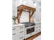 Modern range with a rustic wood vent hood and geometric backsplash at 1086 Cinder St, Mount Pleasant, SC 29464