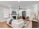 Living room with white sofa, fireplace, and hardwood floors at 1086 Cinder St, Mount Pleasant, SC 29464