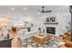 Bright living room with white sofa, fireplace, and hardwood floors at 1086 Cinder St, Mount Pleasant, SC 29464