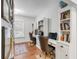 Home office with two desks, built-in shelves, and hardwood floors at 1086 Cinder St, Mount Pleasant, SC 29464