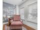 Relaxing sitting area with pink armchair, record player, and nature wall mural at 1086 Cinder St, Mount Pleasant, SC 29464