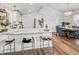 Modern kitchen with white cabinets, marble countertops, and a breakfast bar at 1109 Calm Water Ct, Mount Pleasant, SC 29464