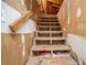 Unfinished attic space with wooden stairs and exposed beams at 115 Three Wood Ln, Summerville, SC 29483