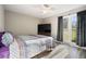 Bedroom with large window, TV and wood flooring at 115 Three Wood Ln, Summerville, SC 29483