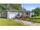 Gray house with a white garage door and red front door at 115 Three Wood Ln, Summerville, SC 29483