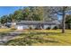 House exterior showcasing a gray siding and a well-maintained lawn at 115 Three Wood Ln, Summerville, SC 29483