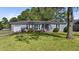 Ranch style house with a gray exterior and landscaped yard at 115 Three Wood Ln, Summerville, SC 29483